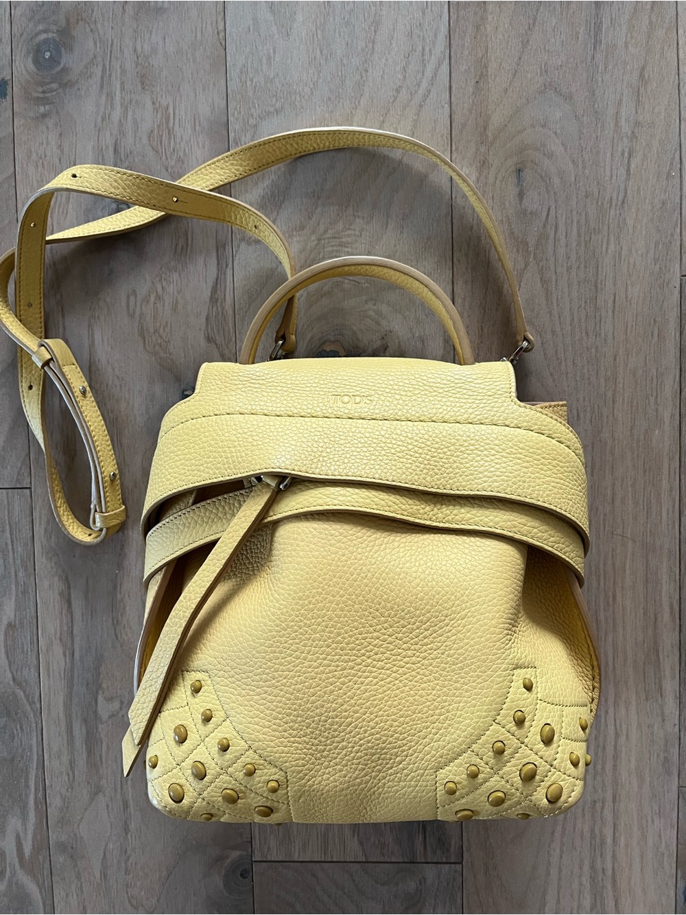 Tod's Yellow Pebbled Leather Mini Wave Studded crossbody/backpack